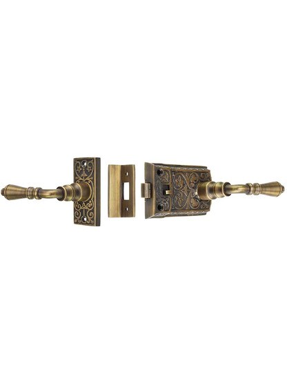 Ornate Cast Brass Screen Door Latch Set In Antique Brass.